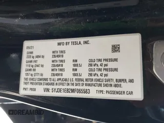 2021 Tesla Model 3 Long Range with VIN 5YJ3E1EB2MF065583, listed as a IAAI auction lot 42067399 with 52,333 mi miles. Bid and sale history available at carsss.com. Image 9.