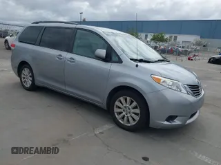 2014 Toyota Sienna LE with VIN 5TDJK3DC1ES080711, listed as a IAAI auction lot 41910679 with 118,788 mi miles. Bid and sale history available at carsss.com. Image 1.