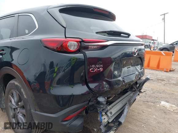 2021 Mazda CX-9 Sport with VIN JM3TCABY6M0522352, listed as a IAAI auction lot 42613136 with 106,167 mi miles and . Bid and sale history available at DreamBid. Image 6.