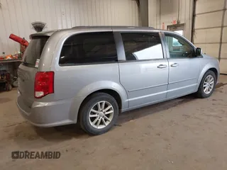 2014 Dodge Grand Caravan SXT with VIN 2C4RDGCG9ER213426, listed as a IAAI auction lot 41044553 with 175,140 mi miles and . Bid and sale history available at DreamBid. Image 4.