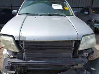 2006 Mercury Mariner Convenience with VIN 4M2YU56Z86KJ12563, listed as a IAAI auction lot 41817401 with 152,156 mi miles and . Bid and sale history available at DreamBid. Image 12.