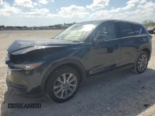 2021 Mazda CX-5 Grand Touring with VIN JM3KFADM1M0301366, listed as a Copart auction lot 52890955 with 66,686 mi miles and Non Repairable. Bid and sale history available at carsss.com. Image 1.