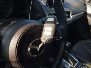 2017 Mazda 3 Touring with VIN 3MZBN1L79HM122581, listed as a IAAI auction lot 42705624 with 52,175 mi miles and . Bid and sale history available at DreamBid. Image 11.
