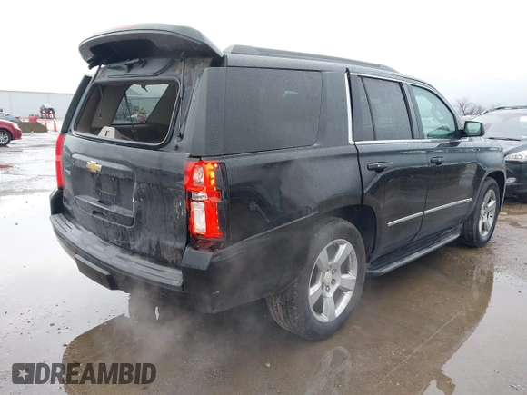 2015 Chevrolet Tahoe LT with VIN 1GNSCBKC2FR632139, listed as a IAAI auction lot 41553087 with 142,775 mi miles and . Bid and sale history available at DreamBid. Image 4.