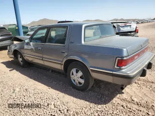 1991 Dodge Dynasty LE z VIN 1B3XC56R9MD115785, wystawiony jako Copart lot #48073715 z przebiegiem 64 483 mil mil oraz Szkoda całkowita • Salvage title. Historia ofert i sprzedaży dostępna na DreamBid. Obrazek 2.