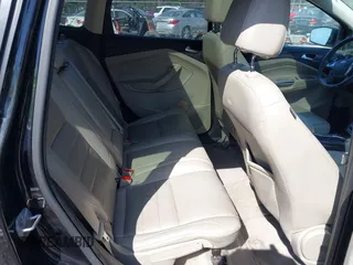 2014 Ford Escape Titanium with VIN 1FMCU9JX2EUA96338, listed as a IAAI auction lot 41806850 with 127,745 mi miles. Bid and sale history available at carsss.com. Image 8.