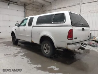 2000 Ford F-150 XL with VIN 1FTRX18L7YNA68432, listed as a IAAI auction lot 41220923 with 203,167 mi miles. Bid and sale history available at carsss.com. Image 3.