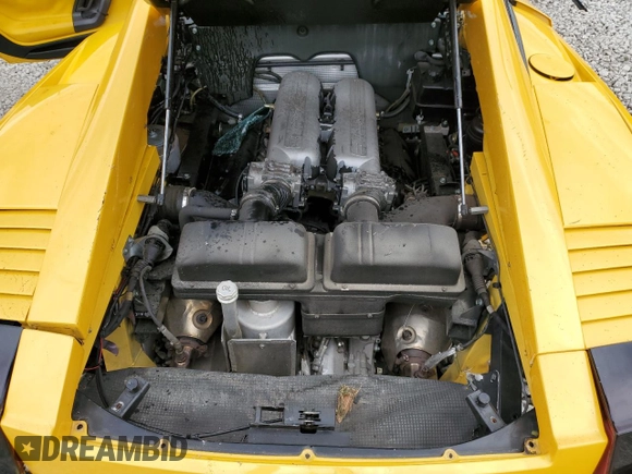 2004 Lamborghini Gallardo z VIN ZHWGU11SX4LA00563, wystawiony jako Copart lot #73732524 z przebiegiem 51 762 mil mil oraz Szkody całkowita. Historia ofert i sprzedaży dostępna na DreamBid. Obrazek 12.