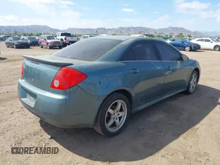 2009 Pontiac G6 1SB with VIN 1G2ZJ57K594261692, listed as a IAAI auction lot 42802373 with 200,469 mi miles and . Bid and sale history available at DreamBid. Image 4.