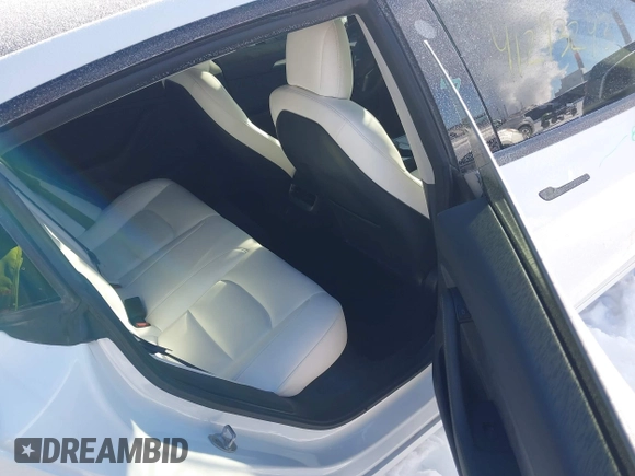 2021 Tesla Model 3 Performance with VIN 5YJ3E1EC1MF063445, listed as a IAAI auction lot 41293243 with 43,143 mi miles and . Bid and sale history available at DreamBid. Image 8.
