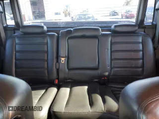 2005 Hummer H2 SUT with VIN 5GRGN22U55H112442, listed as a Copart auction lot 86158414 with 135,411 mi miles and Salvage Title. Bid and sale history available at carsss.com. Image 10.