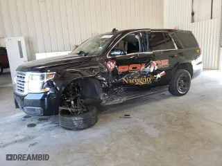 2020 Chevrolet Tahoe Commercial with VIN 1GNLCDEC1LR297818, listed as a Copart auction lot 74242524 with 35,716 mi miles and Salvage Title. Bid and sale history available at carsss.com. Image 1.