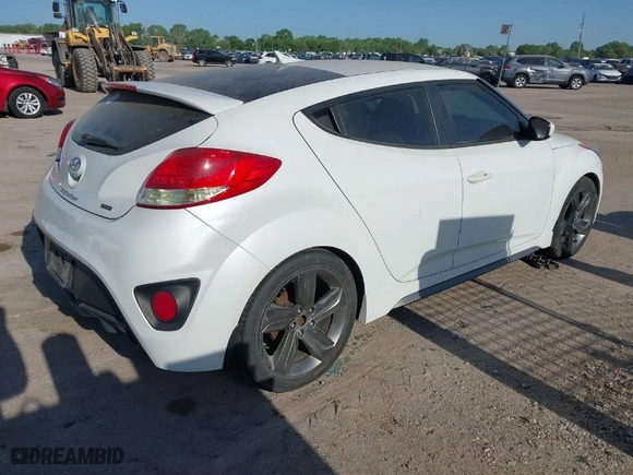2015 Hyundai Veloster Turbo with VIN KMHTC6AE5FU228008, listed as a IAAI auction lot 42016707 with 122,507 mi miles. Bid and sale history available at carsss.com. Image 4.