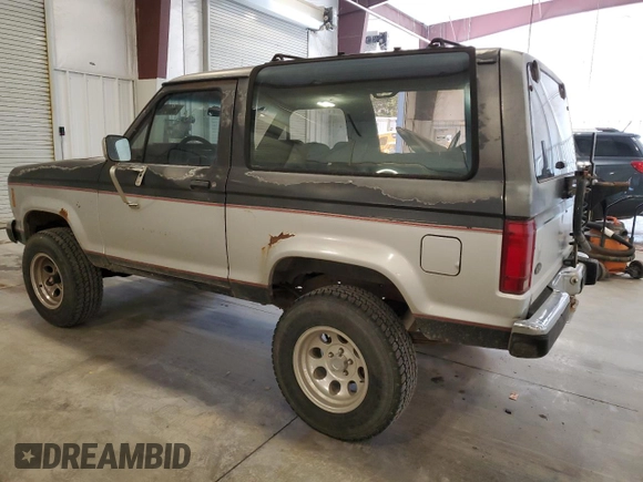 1988 Ford Bronco with VIN 1FMCU14T4JUA54161, listed as a Copart auction lot 76312054 with 34,932 mi miles and Salvage title. Bid and sale history available at DreamBid. Image 2.