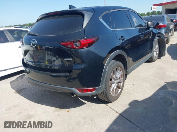 2019 Mazda CX-5 Grand Touring with VIN JM3KFBDM2K0564047, listed as a IAAI auction lot 42000455 with 152,590 mi miles and . Bid and sale history available at carsss.com. Image 4.