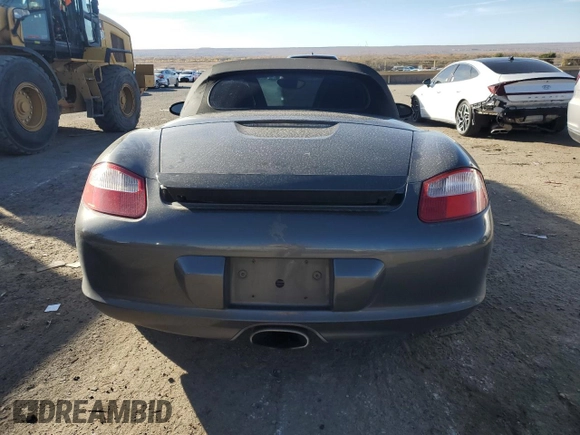 2006 Porsche Boxster с VIN WP0CA29816U710539, выставлен на аукционе Copart как лот 80785334 с пробегом 104 041 миль миль и Списание • Salvage title. История ставок и продаж доступна на DreamBid. Изображение 6.