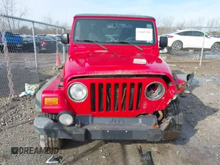 2003 Jeep Wrangler Sport with VIN 1J4FA49S53P305096, listed as a IAAI auction lot 41685209 with 165,247 mi miles. Bid and sale history available at carsss.com. Image 12.