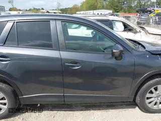 2016 Mazda CX-5 Touring with VIN JM3KE2CYXG0647921, listed as a IAAI auction lot 41948068 with 133,733 mi miles and . Bid and sale history available at DreamBid. Image 13.