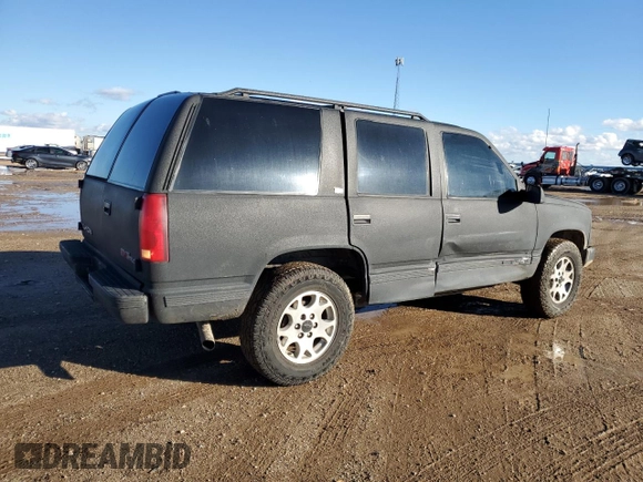 1997 GMC Yukon with VIN 1GKEK13R0VJ710179, listed as a Copart auction lot 81374234 with 186,257 mi miles and Salvage Title. Bid and sale history available at carsss.com. Image 3.