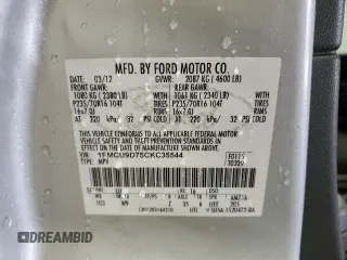 2012 Ford Escape XLT with VIN 1FMCU9D75CKC35544, listed as a Copart auction lot 65014435 with 135,740 mi miles and Salvage title. Bid and sale history available at DreamBid. Image 14.