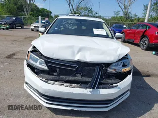 2015 Volkswagen Jetta SE z VIN 3VWD17AJXFM327152, wystawiony jako IAAI lot #42055458 z przebiegiem 69 412 mil mil oraz . Historia ofert i sprzedaży dostępna na DreamBid. Obrazek 13.