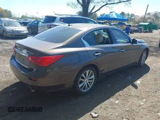 2014 Infiniti Q50 Premium with VIN JN1BV7ARXEM684719, listed as a IAAI auction lot 42122949 with 126,656 mi miles and . Bid and sale history available at DreamBid. Image 4.