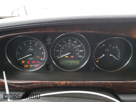 2004 Jaguar XJ with VIN SAJEA74C34SG09548, listed as a Copart auction lot 71754774 with 142,804 mi miles and Salvage Title. Bid and sale history available at DreamBid. Image 9.