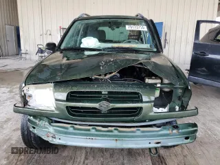2000 Suzuki Vitara JLS z VIN 2S3TE52VXY6110157, wystawiony jako Copart lot #79173714 z przebiegiem 165 283 mil mil oraz Nie do naprawy. Historia ofert i sprzedaży dostępna na DreamBid. Obrazek 5.