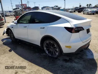 2022 Tesla Model Y Long Range z VIN 7SAYGDEEXNF455766, wystawiony jako Copart lot #49641685 z przebiegiem 51 142 mil mil oraz Szkoda całkowita • Salvage title. Historia ofert i sprzedaży dostępna na DreamBid. Obrazek 2.