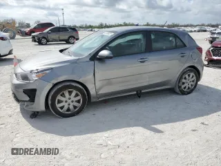 2023 Kia Rio S with VIN 3KPA25ADXPE597494, listed as a Copart auction lot 45399025 with 26,345 mi miles and Salvage Title. Bid and sale history available at DreamBid. Image 1.