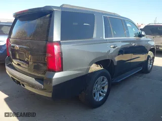 2020 Chevrolet Tahoe LT with VIN 1GNSCBKCXLR309128, listed as a IAAI auction lot 41641948 with 104,571 mi miles. Bid and sale history available at carsss.com. Image 4.