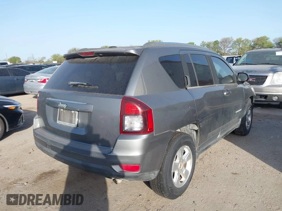 2014 Jeep Compass Sport with VIN 1C4NJCBA6ED620698, listed as a IAAI auction lot 41852056 with 193,085 mi miles and . Bid and sale history available at DreamBid. Image 4.