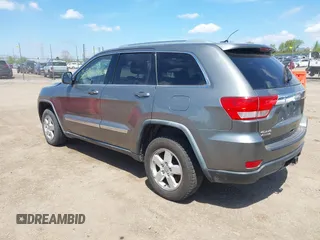2011 Jeep Grand Cherokee Laredo with VIN 1J4RR4GGXBC587911, listed as a IAAI auction lot 42156885 with 178,999 mi miles and . Bid and sale history available at DreamBid. Image 3.