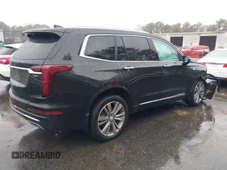2022 Cadillac XT6 Premium Luxury z VIN 1GYKPDRS8NZ161368, wystawiony jako IAAI lot #41115620 z przebiegiem 140 819 mil mil oraz . Historia ofert i sprzedaży dostępna na DreamBid. Obrazek 4.