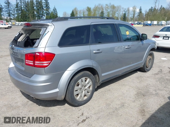 2016 Dodge Journey SE with VIN 3C4PDCAB2GT102871, listed as a IAAI auction lot 42009827 with 197,646 mi miles. Bid and sale history available at carsss.com. Image 4.