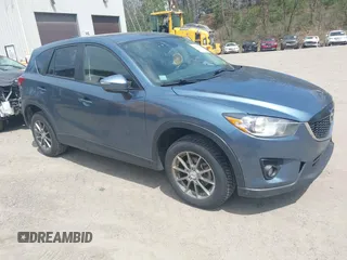 2015 Mazda CX-5 Grand Touring with VIN JM3KE4DY7F0517636, listed as a IAAI auction lot 42146895 with 186,907 mi miles. Bid and sale history available at carsss.com. Image 1.