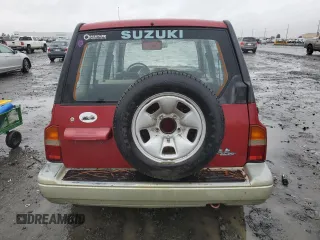 1998 Suzuki Sidekick z VIN JS3TD21VXW4103386, wystawiony jako Copart lot #86219924 z przebiegiem 172 959 mil mil oraz Szkody całkowita. Historia ofert i sprzedaży dostępna na DreamBid. Obrazek 6.