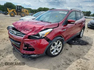 2015 Ford Escape Titanium with VIN 1FMCU0J97FUA59784, listed as a Copart auction lot 63467085 with 144,125 mi miles and Salvage title. Bid and sale history available at DreamBid. Image 1.