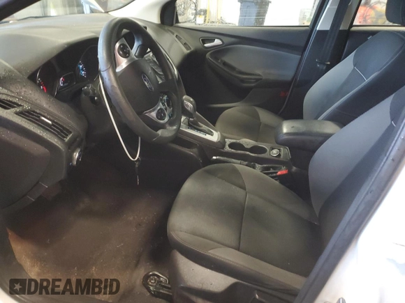 2014 Ford Focus SE with VIN 1FADP3F25EL449810, listed as a Copart auction lot 73174364 with 140,031 mi miles and Salvage Title. Bid and sale history available at DreamBid. Image 7.