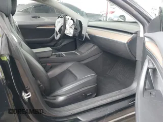 2023 Tesla Model 3 with VIN 5YJ3E1EA7PF473749, listed as a IAAI auction lot 41921478 with 21,483 mi miles and . Bid and sale history available at DreamBid. Image 5.