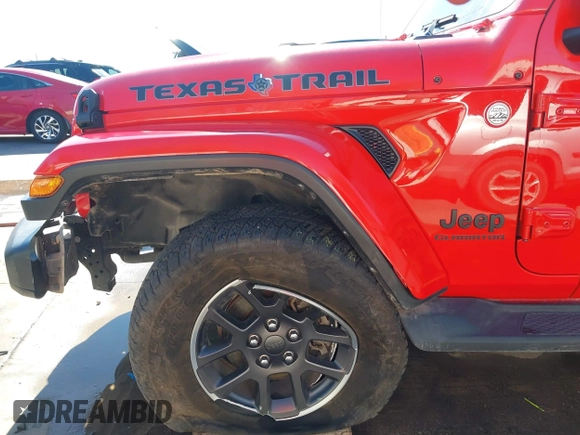 2021 Jeep Gladiator Freedom z VIN 1C6HJTAG7ML609661, wystawiony jako IAAI lot #41410756 z przebiegiem 44 636 mil mil oraz . Historia ofert i sprzedaży dostępna na DreamBid. Obrazek 17.