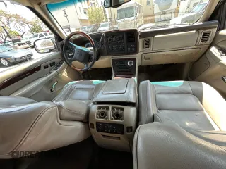 2002 Cadillac Escalade z VIN 1GYEC63T22R113253, wystawiony jako Copart lot #56408115 z przebiegiem 249 604 mil mil oraz Szkody całkowita. Historia ofert i sprzedaży dostępna na DreamBid. Obrazek 9.