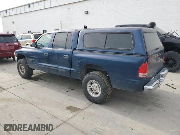 2002 Dodge Dakota SLT with VIN 1B7HG48N32S720700, listed as a Copart auction lot 80234494 with 207,035 mi miles and Salvage Title. Bid and sale history available at carsss.com. Image 2.