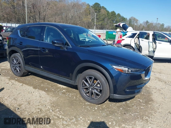 2018 Mazda CX-5 Grand Touring with VIN JM3KFADM1J0322049, listed as a IAAI auction lot 41891079 with 174,939 mi miles and . Bid and sale history available at DreamBid. Image 1.