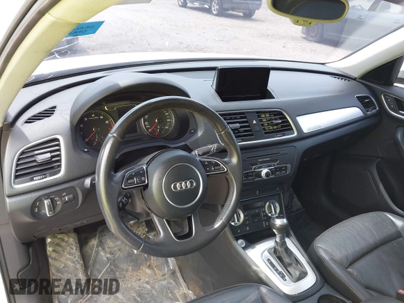 2015 Audi Q3 Premium Plus z VIN WA1EFCFS8FR001278, wystawiony jako IAAI lot #42475043 z przebiegiem 125 417 mil mil oraz . Historia ofert i sprzedaży dostępna na DreamBid. Obrazek 19.