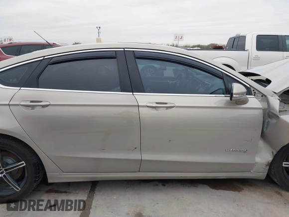 2016 Ford Fusion Titanium Hybrid with VIN 3FA6P0RU9GR143203, listed as a IAAI auction lot 41332144 with 94,357 mi miles. Bid and sale history available at carsss.com. Image 14.