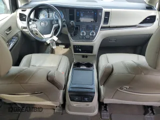 2016 Toyota Sienna XLE with VIN 5TDYK3DC3GS730639, listed as a Copart auction lot 57379935 with 105,323 mi miles and Salvage title. Bid and sale history available at DreamBid. Image 8.