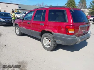 2003 Jeep Grand Cherokee Laredo with VIN 1J4GW48S33C556441, listed as a IAAI auction lot 42026804 with 189,143 mi miles. Bid and sale history available at carsss.com. Image 3.