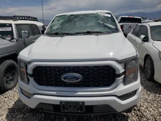 2023 Ford F-150 XL with VIN 1FTEW1EPXPFC20804, listed as a Copart auction lot 56555615 with 60,984 mi miles and Salvage title. Bid and sale history available at DreamBid. Image 5.
