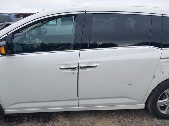 2012 Honda Odyssey Touring with VIN 5FNRL5H93CB034485, listed as a IAAI auction lot 42304502 with 198,589 mi miles and . Bid and sale history available at DreamBid. Image 14.